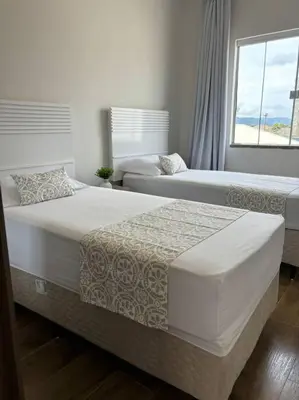Uma cama ou camas num quarto em Sobrado com garagem e churrasqueira