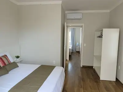 Uma cama ou camas num quarto em Sobrado com garagem e churrasqueira