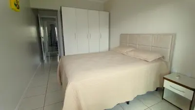 Uma cama ou camas num quarto em 1014 - Apartamento no centro de Bombinhas