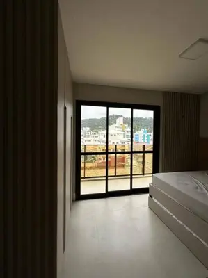 Uma cama ou camas num quarto em Praia de Palmas Apto Novo, Vista para o mar.