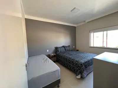 Uma cama ou camas num quarto em Apartamento De Praia em Bombinhas