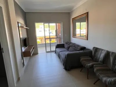 Uma área de estar em Apartamento De Praia em Bombinhas