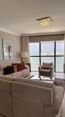 Uma área de estar em Apto totalmente FRENTE MAR, 4 quartos, alto padrão, Itapema