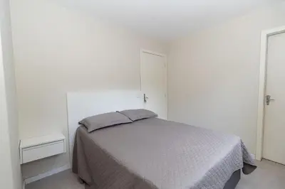 Uma cama ou camas num quarto em 540B - Linda casa com 5 dormitórios á 100m da praia