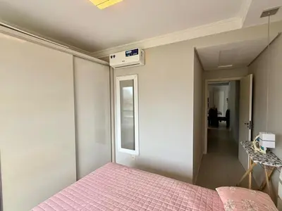 Uma cama ou camas num quarto em Apto 2 quartos na praia de palmas