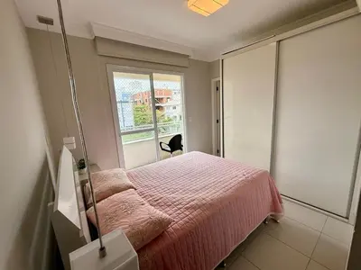 Uma cama ou camas num quarto em Apto 2 quartos na praia de palmas