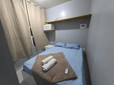 Uma cama ou camas num quarto em RL Suíte com cama de casal, com banheiro privado, ar split, wifi em Sobrado, sem áreas compartilhadas, somente acesso comum qqq