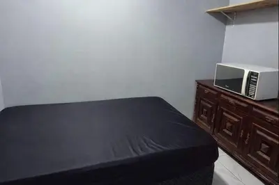 Uma cama ou camas num quarto em RL Suíte com cama de casal, com banheiro privado, ar split, wifi em Sobrado, sem áreas compartilhadas, somente acesso comum qqq