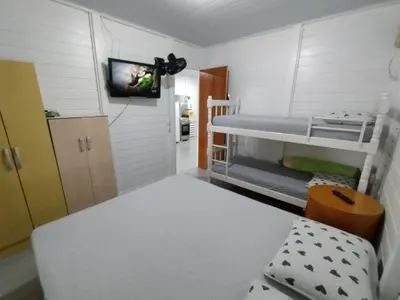 Uma cama ou camas num quarto em Cantinho do Sossego