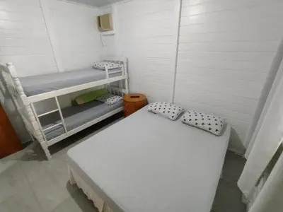 Uma cama ou camas num quarto em Cantinho do Sossego