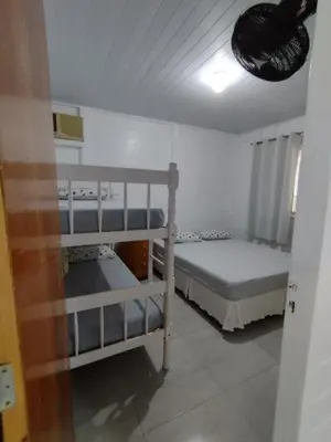 Uma cama ou camas num quarto em Cantinho do Sossego
