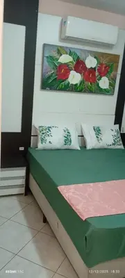 Uma cama ou camas num quarto em Excelente apto com Piscina privativa em Bombas