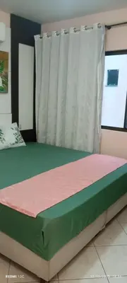 Uma cama ou camas num quarto em Excelente apto com Piscina privativa em Bombas