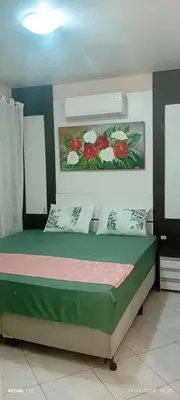 Uma cama ou camas num quarto em Excelente apto com Piscina privativa em Bombas