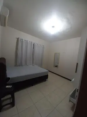 Uma cama ou camas num quarto em Casa em Bombinhas