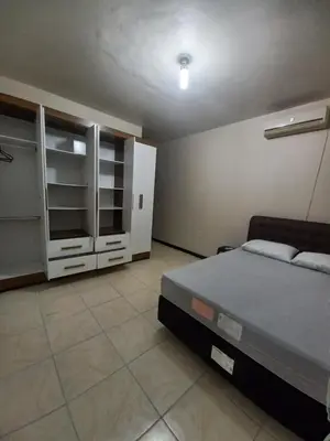 Uma cama ou camas num quarto em Casa em Bombinhas