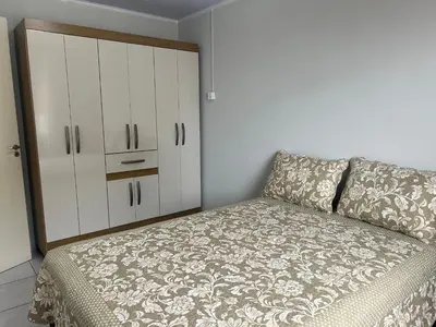 Uma cama ou camas num quarto em Casa completa - Governador Celso Ramos à 15min da praia de palmas