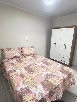 Uma cama ou camas num quarto em Casa completa - Governador Celso Ramos à 15min da praia de palmas