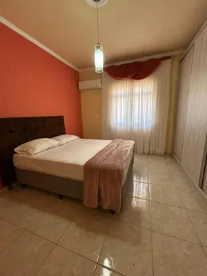 Uma cama ou camas num quarto em Residência Vó Nilton