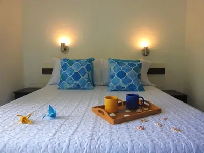 Uma cama ou camas num quarto em Residencial Vila do Sol, Apartamentos com pé na areia