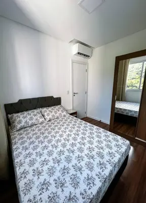 Uma cama ou camas num quarto em Apartamento em itapema com maravilhosa vista mar
