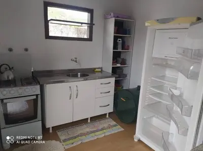 A cozinha ou kitchenette de Casa no centro da cidade a 600 metros da praia.