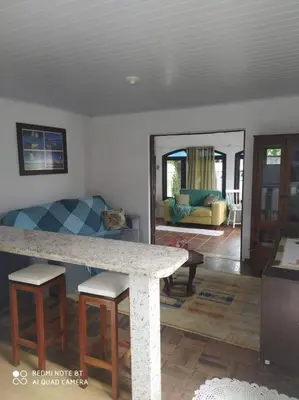 Uma área de estar em Casa no centro da cidade a 600 metros da praia.