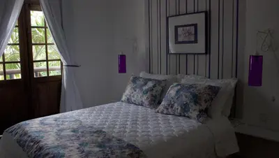 Uma cama ou camas num quarto em Pousada Narinari