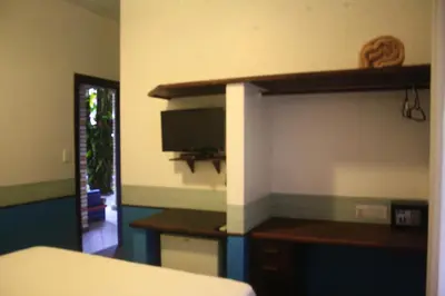 Uma cama ou camas num quarto em Pousada Narinari