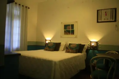 Uma cama ou camas num quarto em Pousada Narinari