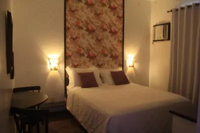Uma cama ou camas num quarto em Pousada Narinari