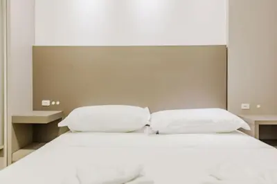 Uma cama ou camas num quarto em Alto Padrão em Itapema, 8min a pé até o Mar FN8750
