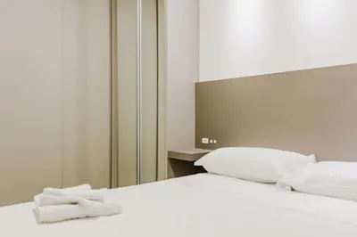 Uma cama ou camas num quarto em Alto Padrão em Itapema, 8min a pé até o Mar FN8750