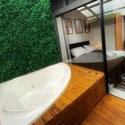 Uma cama ou camas num quarto em Loft1 com Jacuzzi para Casal - Lofts Mariscal, Bombinhas-SC