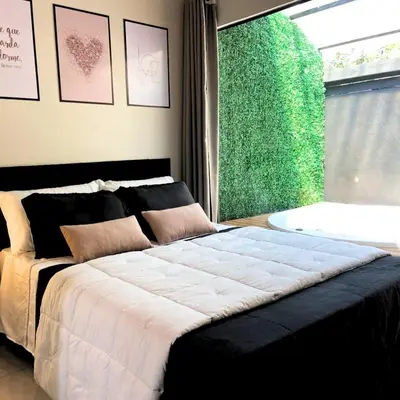 Uma cama ou camas num quarto em Loft2 com Jacuzzi para Casal - Lofts Mariscal, Bombinhas-SC