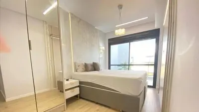 Uma cama ou camas num quarto em Cobertura Palmas