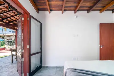 Uma cama ou camas num quarto em A88 - Casa frente mar no centro de Bombinhas.