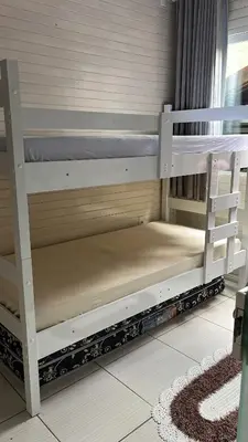 Uma ou mais camas em beliche num quarto em Casa aconchegante em Governador Celso Ramos - Nazário