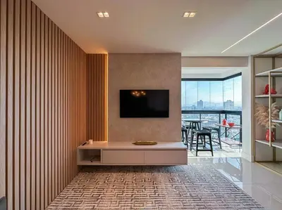 Uma televisão e/ou sistema de entretenimento em Apartamento Novo Quadra Mar