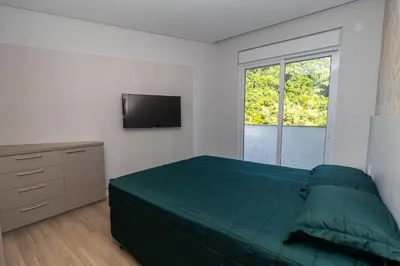 Uma cama ou camas num quarto em Varandas do Atlântico 502A – Frente Mar em Bombas