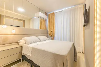 Uma cama ou camas num quarto em Aconchegante Apartamento para Famílias na Praia de Bombinhas - Centro
