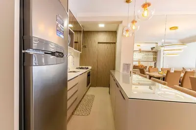A cozinha ou kitchenette de Aconchegante Apartamento para Famílias na Praia de Bombinhas - Centro