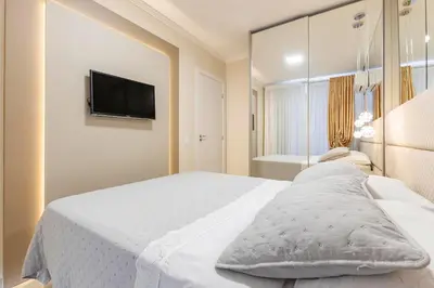 Uma cama ou camas num quarto em Aconchegante Apartamento para Famílias na Praia de Bombinhas - Centro