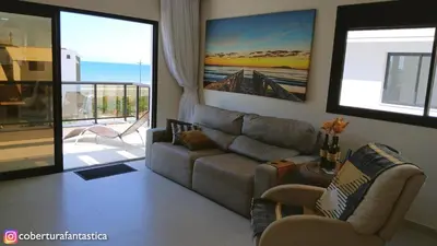 Uma área de estar em Cobertura fantástica apenas 70 metros da praia