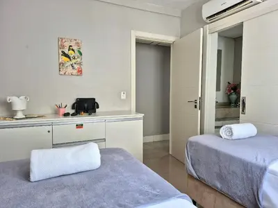 Uma cama ou camas num quarto em Portinari Charmoso Área Gourmet 3 Q |CURTA192