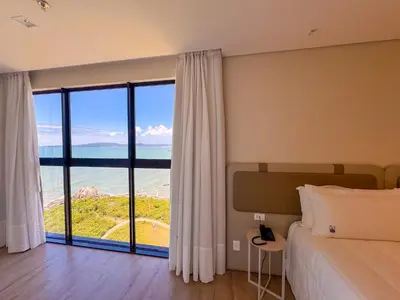 Uma cama ou camas num quarto em Blue Sea Hotel