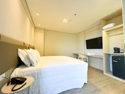 Uma televisão e/ou sistema de entretenimento em Blue Sea Hotel