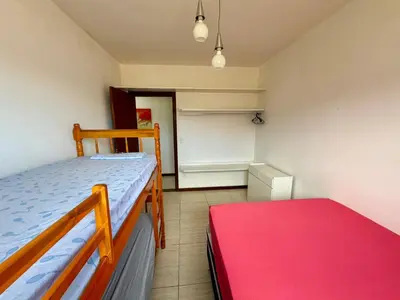 Uma cama ou camas num quarto em Apartamento na linda Praia Palmas SC 3
