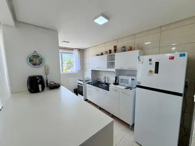 A cozinha ou kitchenette de Apartamento na linda Praia Palmas SC 3