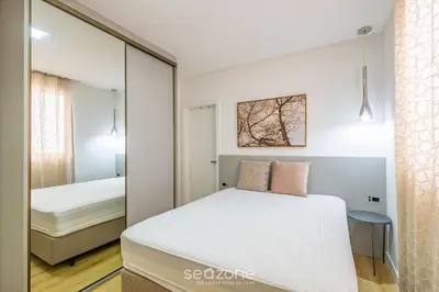 Uma cama ou camas num quarto em Apto 3 suítes 280m do mar Itapema-SC VGA1002